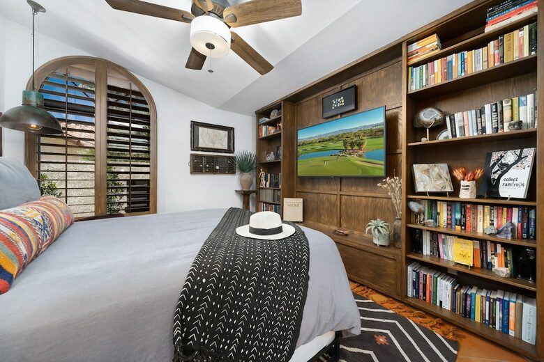 Home Exchange in La Quinta, CA queen bedroom with built in shelves