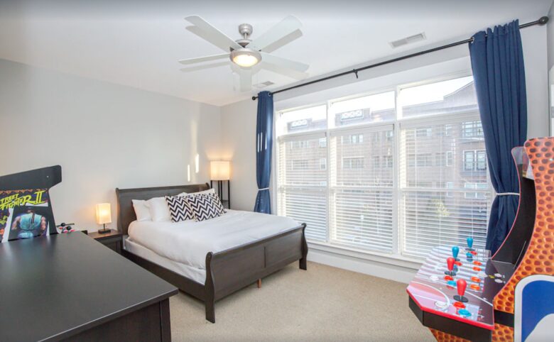 Bedroom with two arcade games