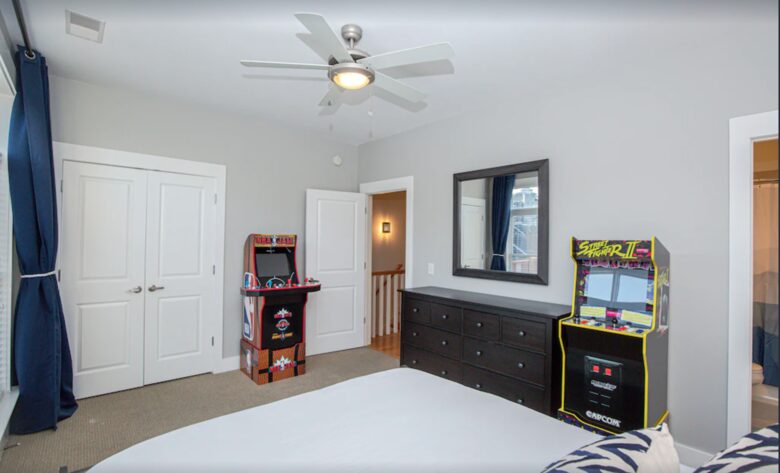 Bedroom with two arcade games