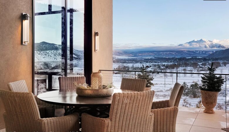 Outdoor covered patio with dining and fireplace