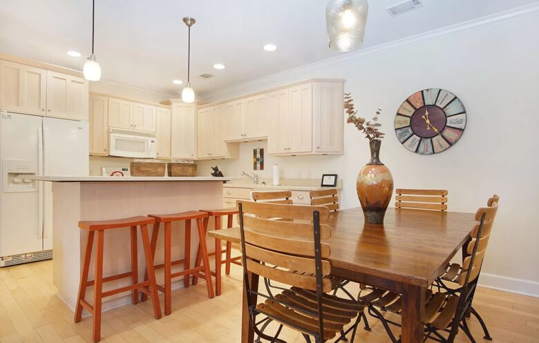 Dining table seats six. Additional seating at bar