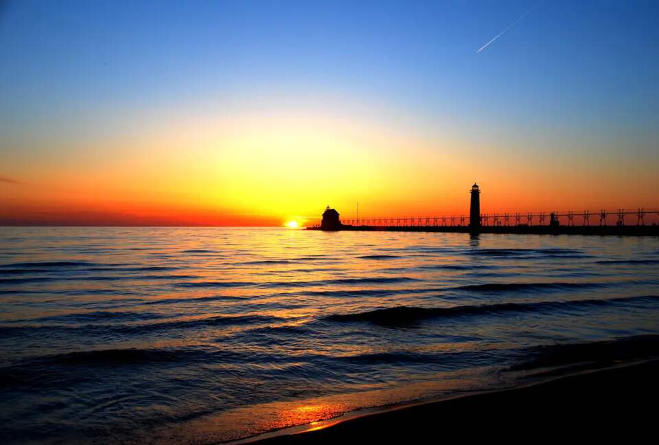 Home Exchange in Grand Haven, MI sunset view over the lake