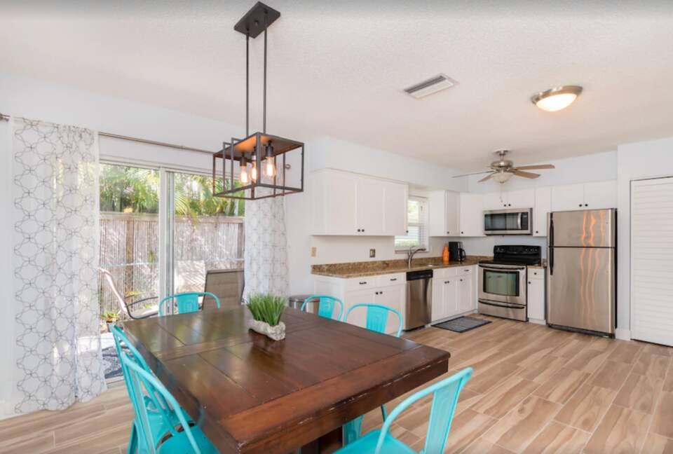 Dining and kitchen open to patio