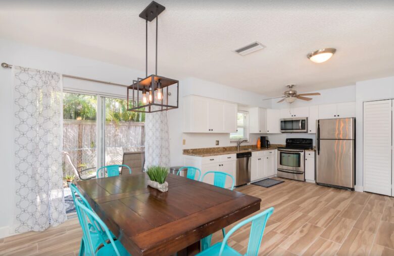 Dining and kitchen open to patio