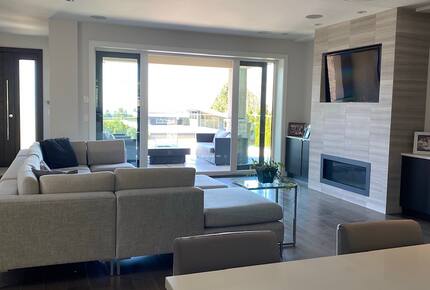 Home Exchange in Vancouver, BC, Canada fireplace with television