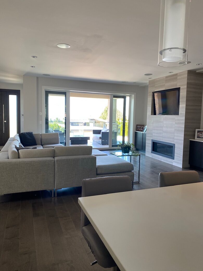 Home Exchange in Vancouver, BC, Canada fireplace with television