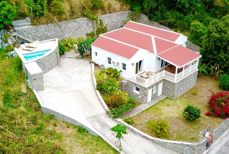 The villa sits in a quiet neighborhood with lots of space.