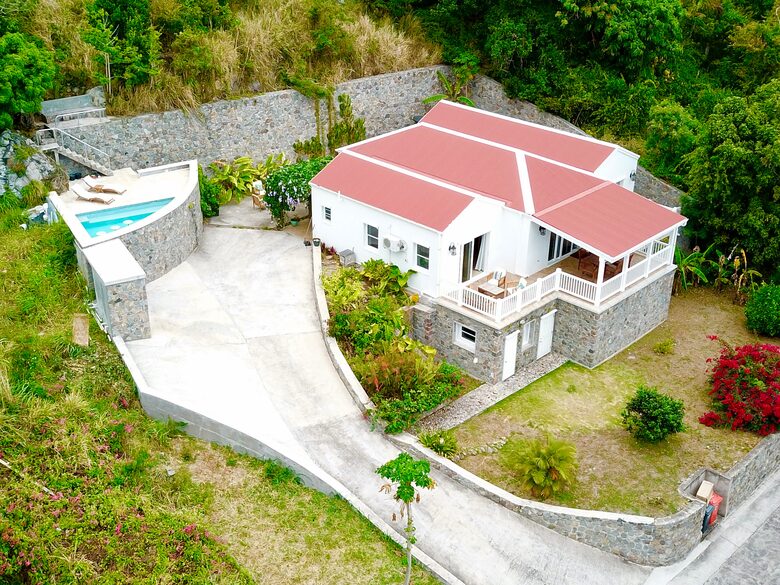 The villa sits in a quiet neighborhood with lots of space.