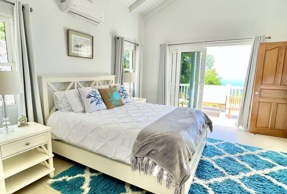 Guest Room suite with ocean views and private balcony.