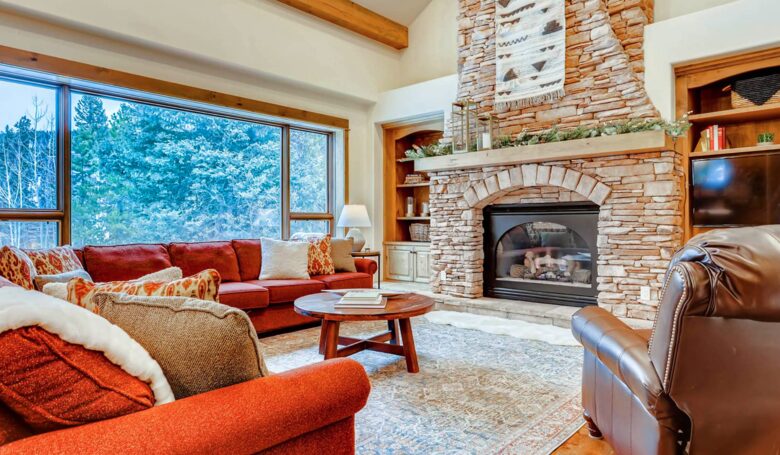 Living room with fireplace and views