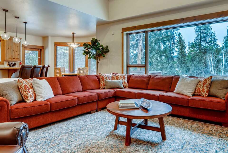 Living room with fireplace and views