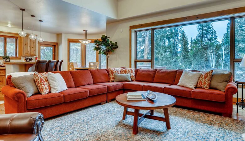 Living room with fireplace and views