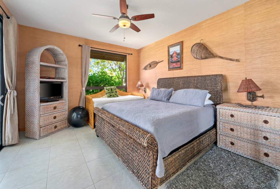 Master bedroom with king bed and extra day bed