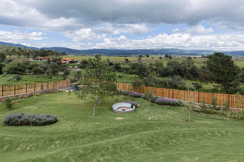 Garden with small lake and fire pit
