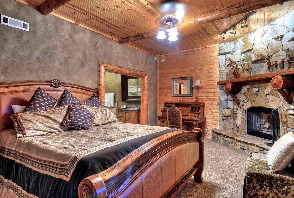 Home Exchange in Big Bear Lake, CA master bedroom with fireplace