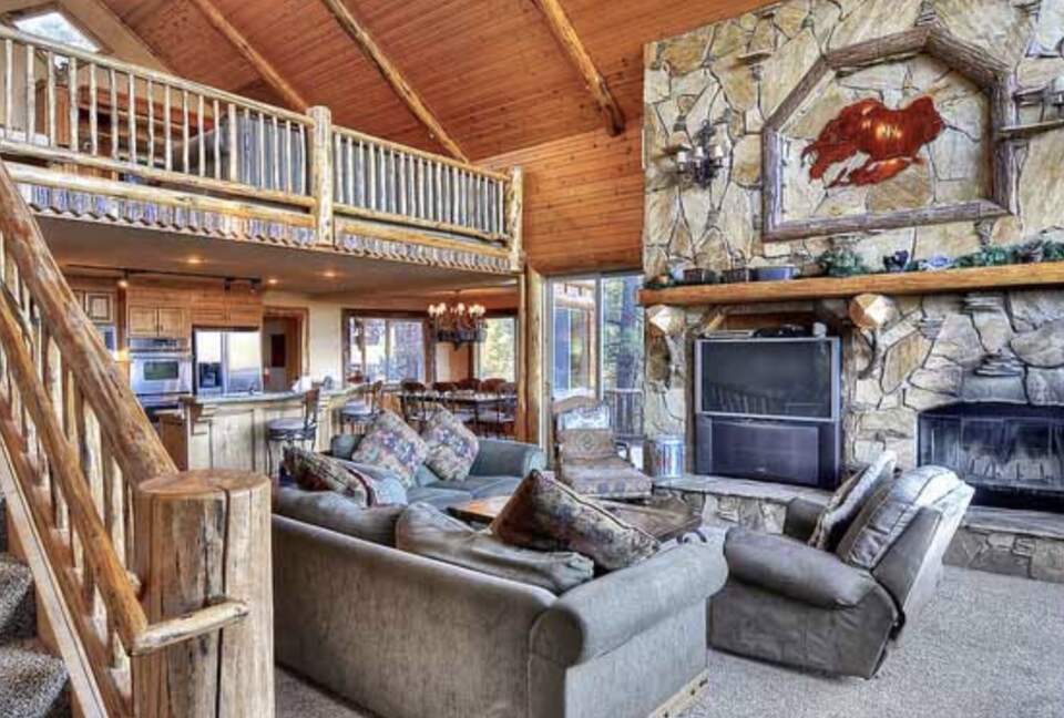 Home Exchange in Big Bear Lake, CA living room with fireplace