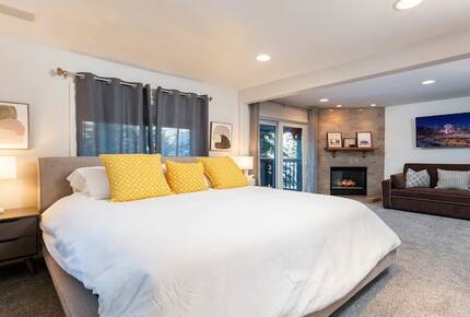 Master bedroom with sofa bed and fireplace