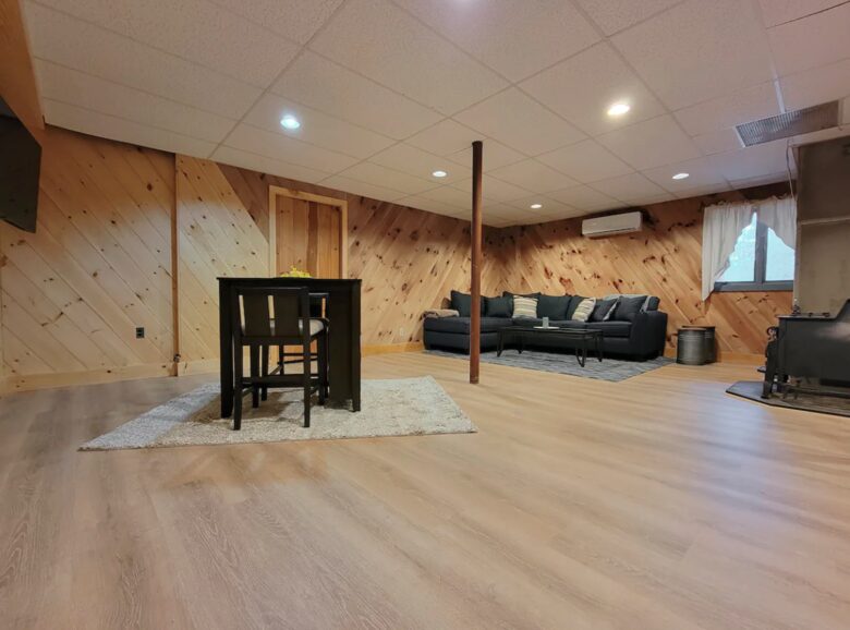 Finished basement with queen sofa bed