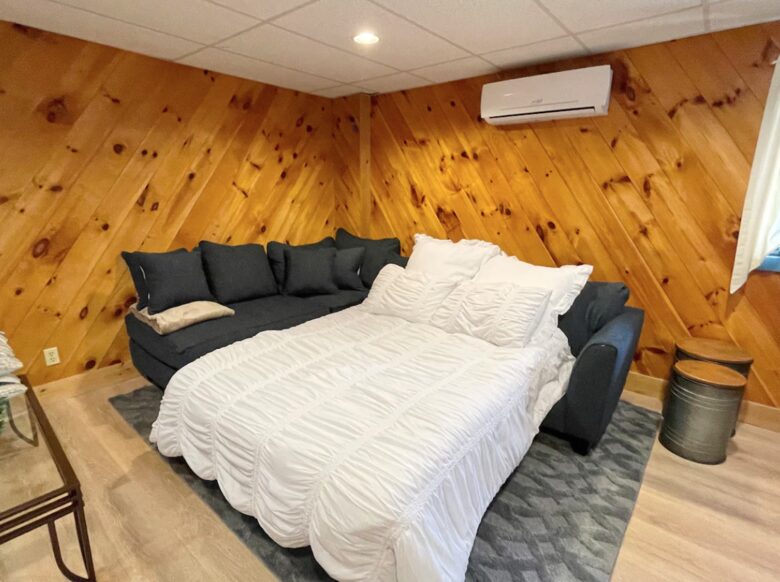Finished basement with queen sofa bed