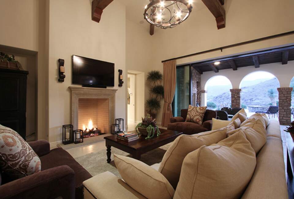 Open living room with fireplace - open to the patio