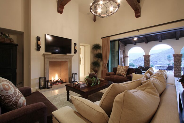 Open living room with fireplace - open to the patio