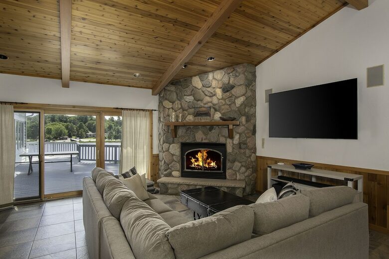 Home Exchange in Eagle River, WI second living space with fireplace