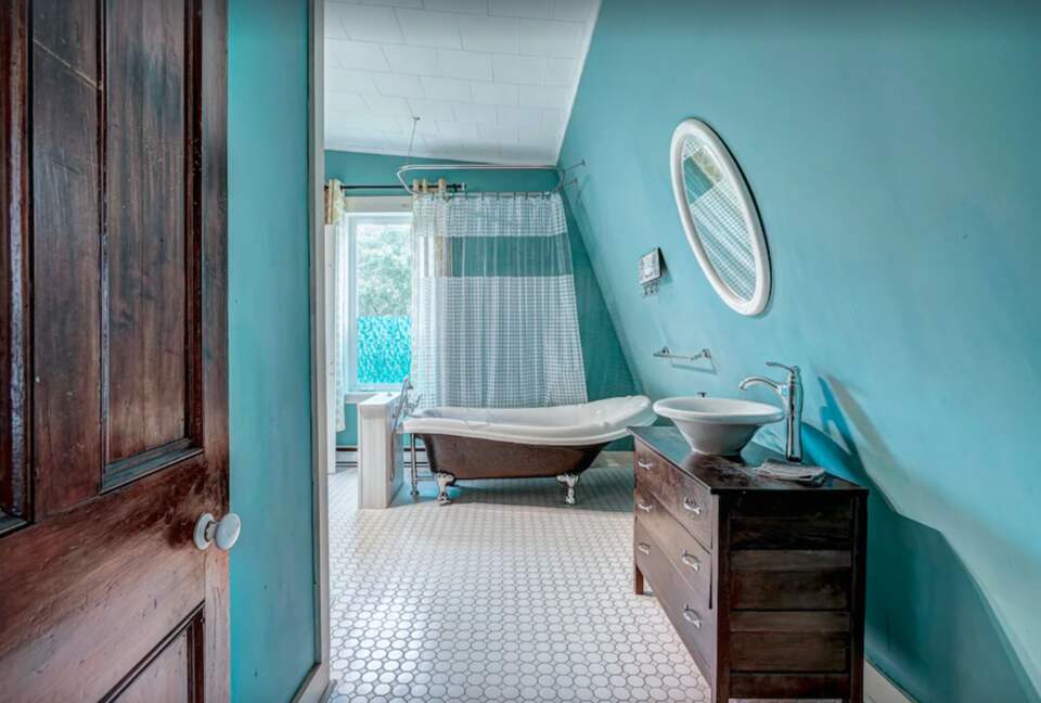 Bathroom with claw foot tub and shower