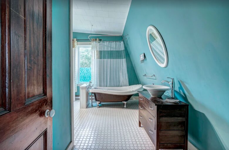 Bathroom with claw foot tub and shower
