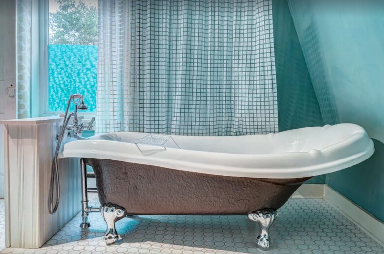 Bathroom with claw foot tub and shower