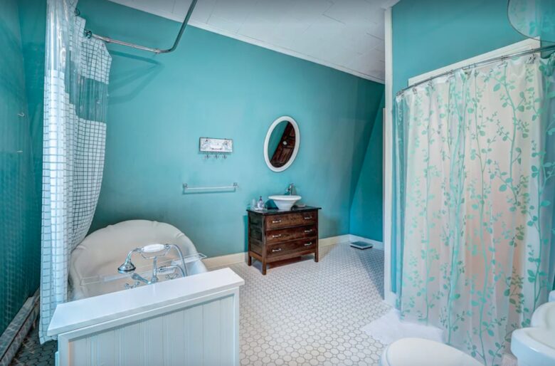 Bathroom with claw foot tub and shower