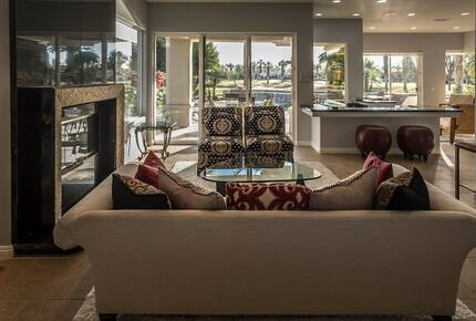 Home Exchange in La Quinta, CA living room with fireplace
