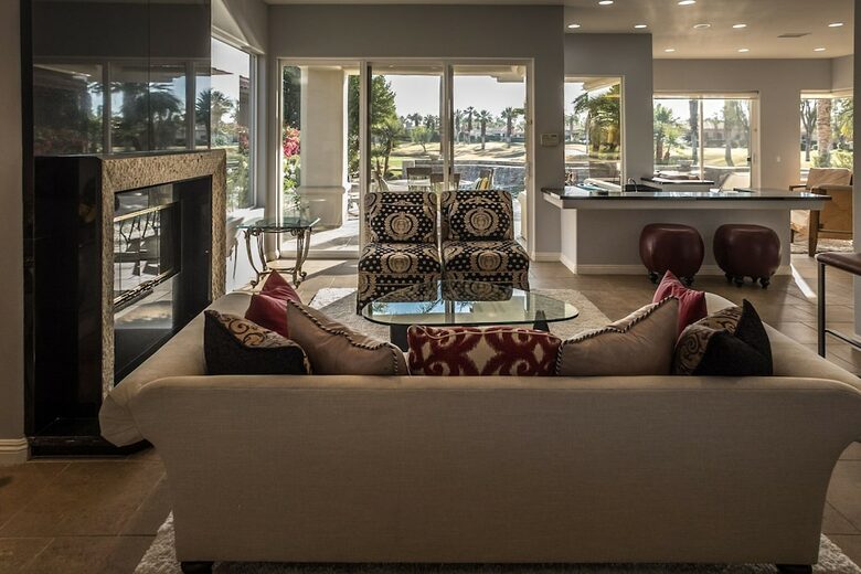 Home Exchange in La Quinta, CA living room with fireplace