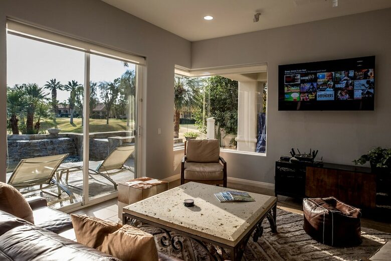 Home Exchange in La Quinta, CA living room with television