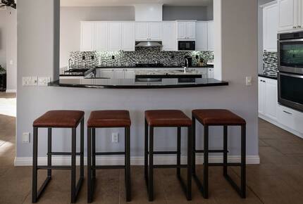 Home Exchange in La Quinta, CA kitchen with bar seating