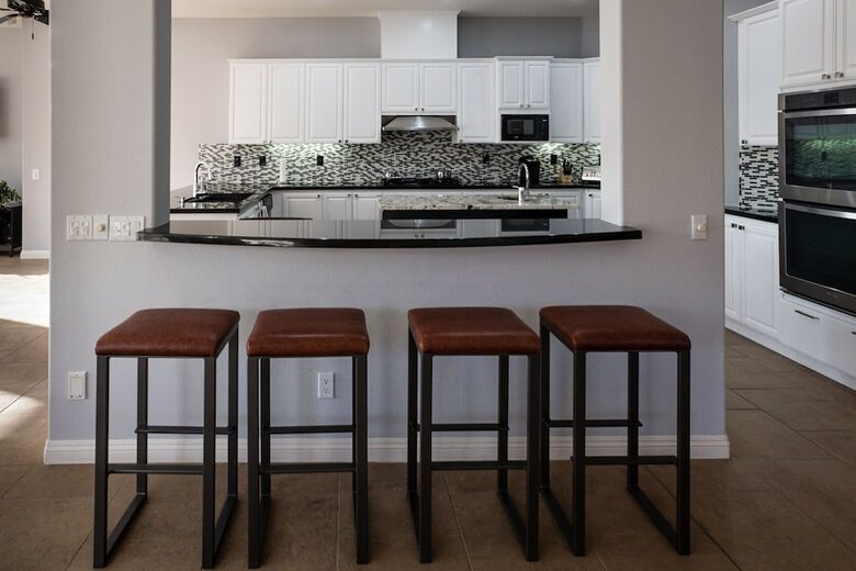 Home Exchange in La Quinta, CA kitchen with bar seating