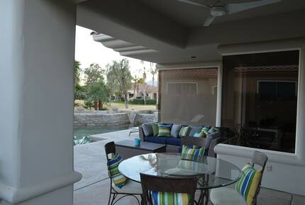 Home Exchange in La Quinta, CA outdoor dining and lounge