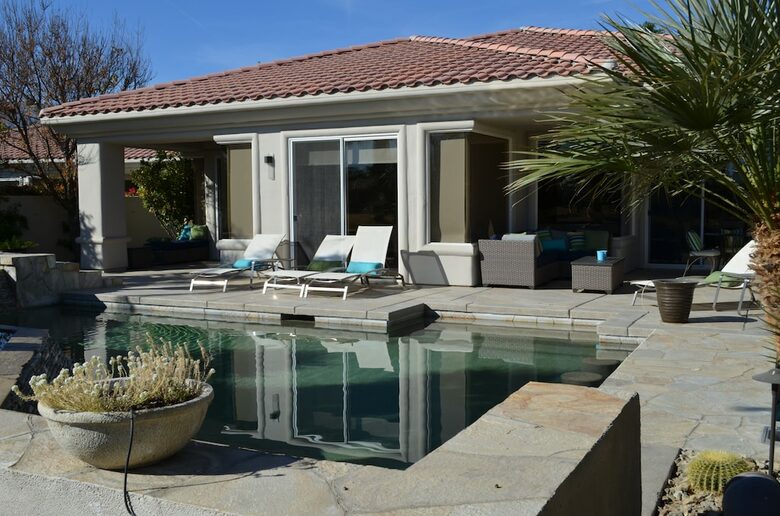 Home Exchange in La Quinta, CA pool with house view