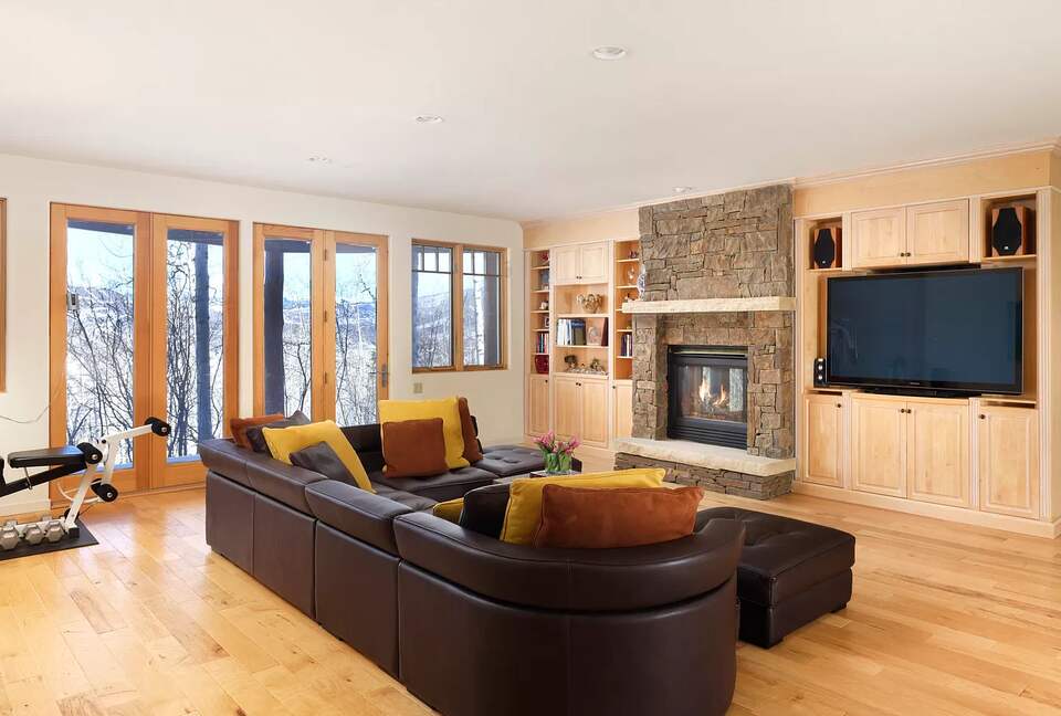 Home Exchange in Snowmass Village second den with fireplace