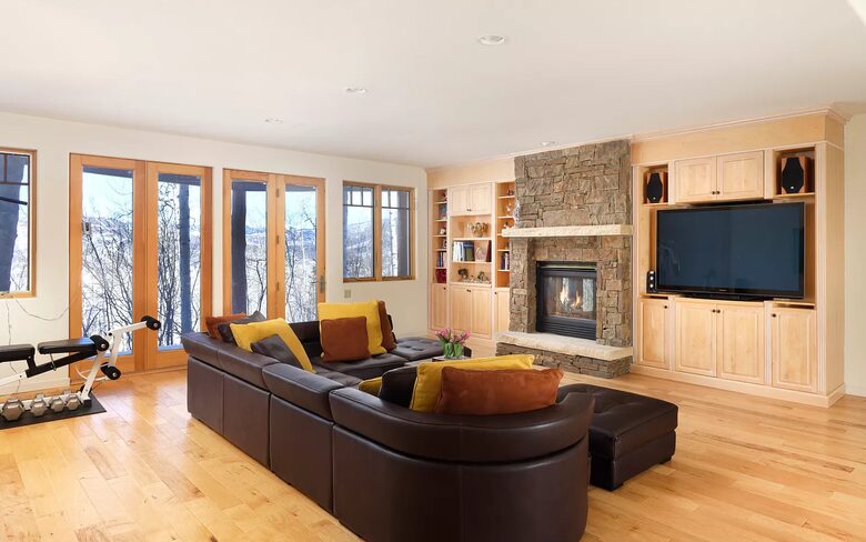Home Exchange in Snowmass Village second den with fireplace