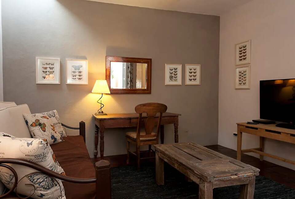 Home Exchange in San Miguel de Allende den with office space and tv