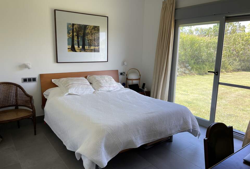 Master bedroom with lovely garden view and en-suite bathroom