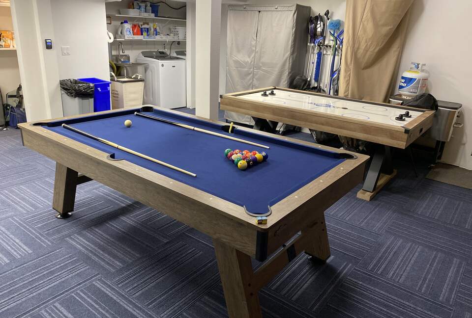 Garage has a game area for guest use.