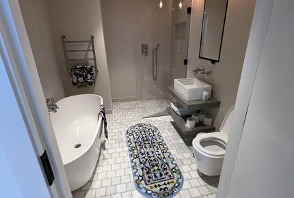 master bathroom with bath and shower