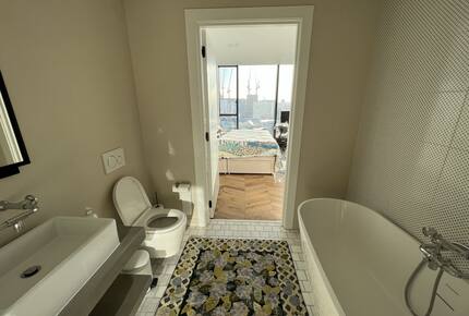 master bathroom with bath and shower