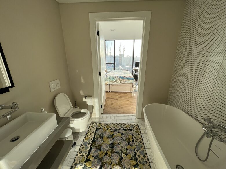 master bathroom with bath and shower