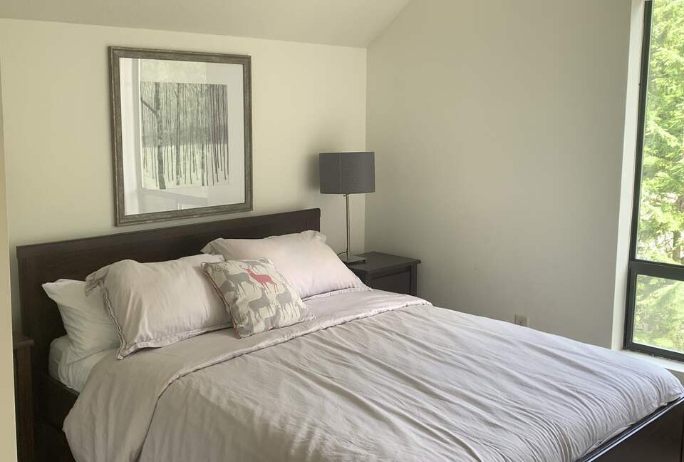 Upstairs bedroom with queen