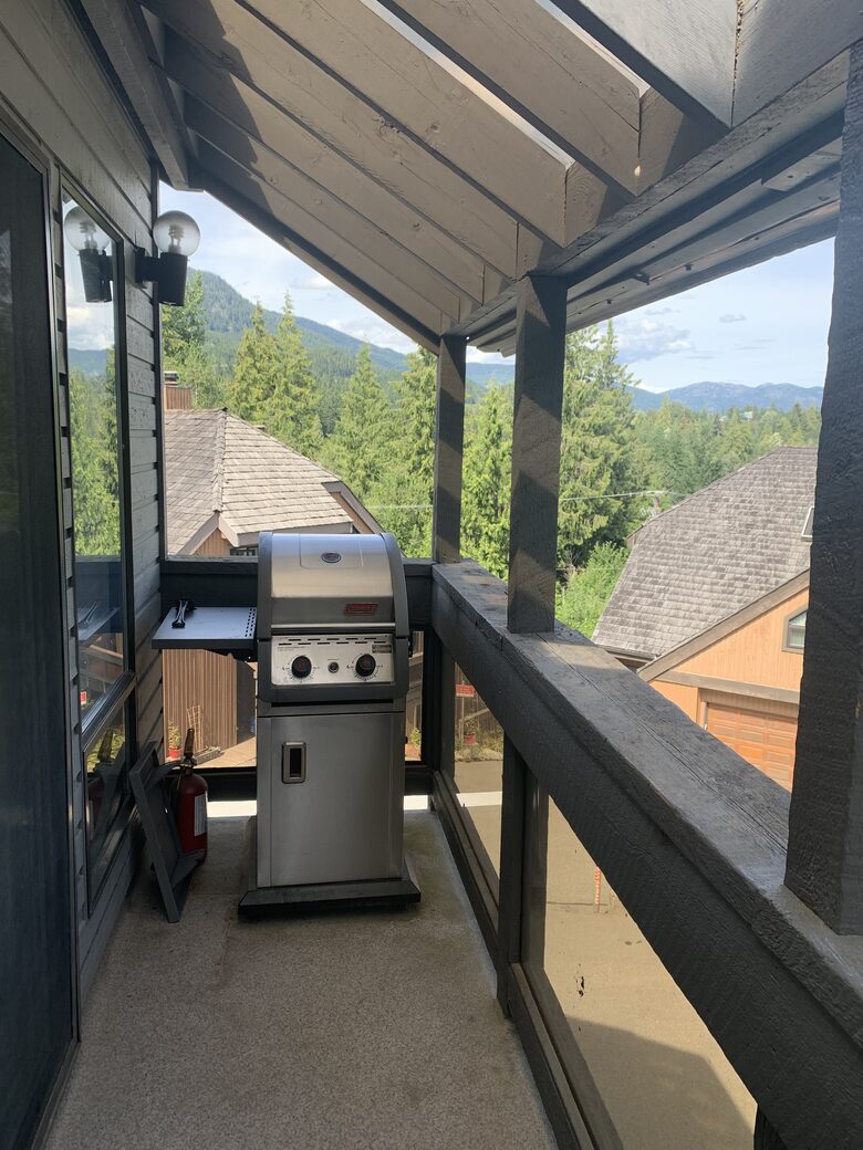 Side deck off dining area with BBQ