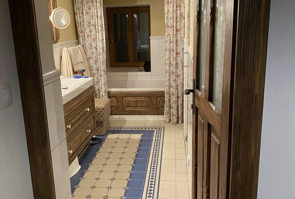 Downstairs bathroom with traditional stone tiles