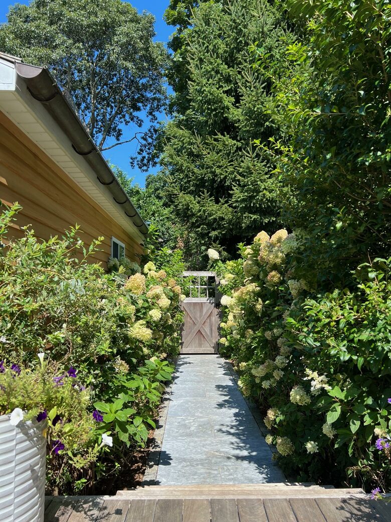 Entry pathway from driveway to main house back deck
