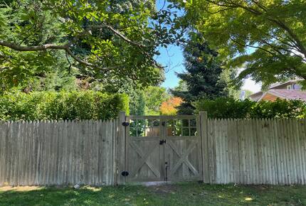 Landscaper gates closing off driveway from yard